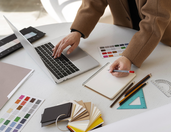 graphic designer picking colors. Visual Insights Outsource.